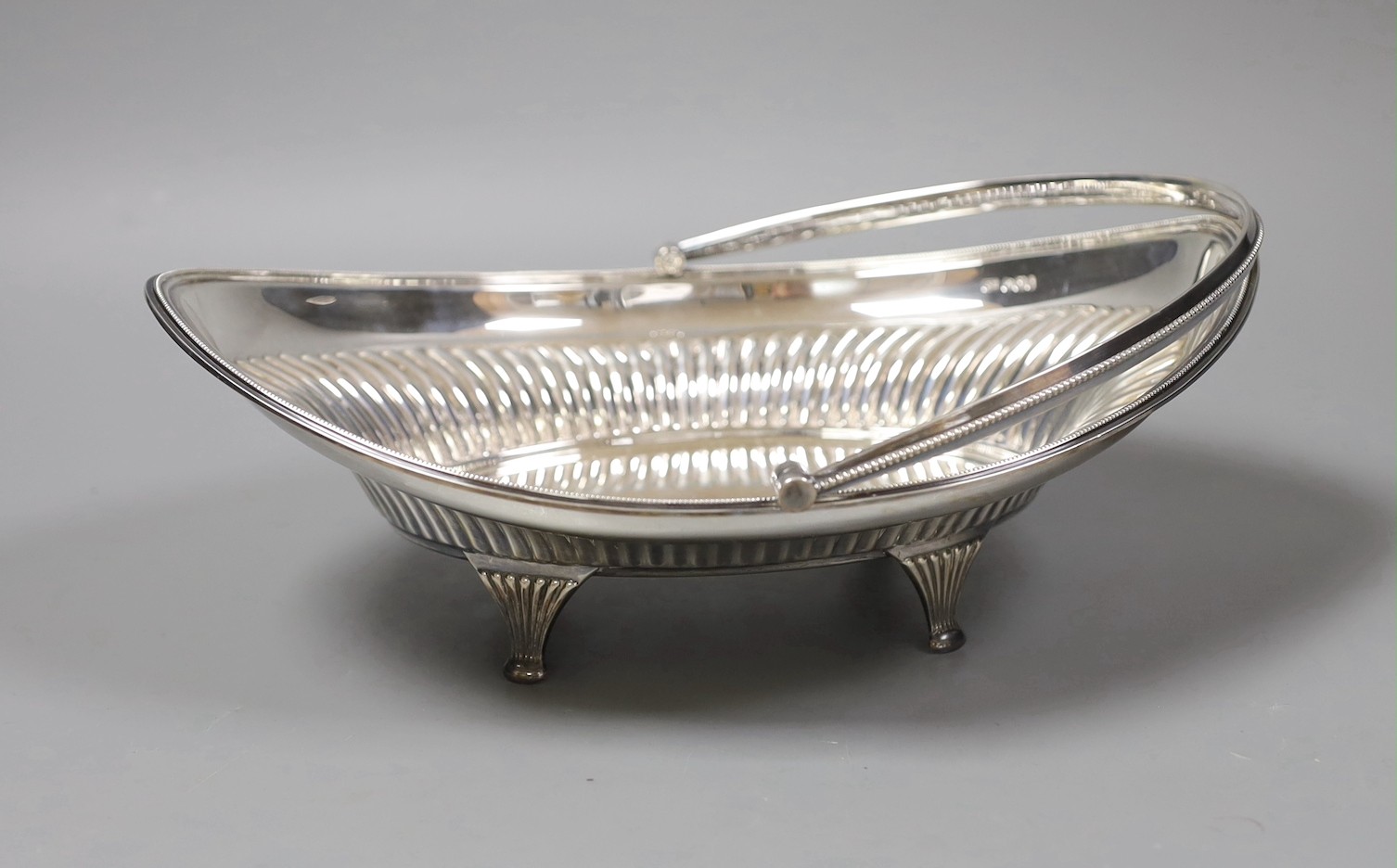 An Edwardian demi fluted oval silver fruit basket, George Howson, Sheffield, 1895, length, 28cm, 17.5oz.